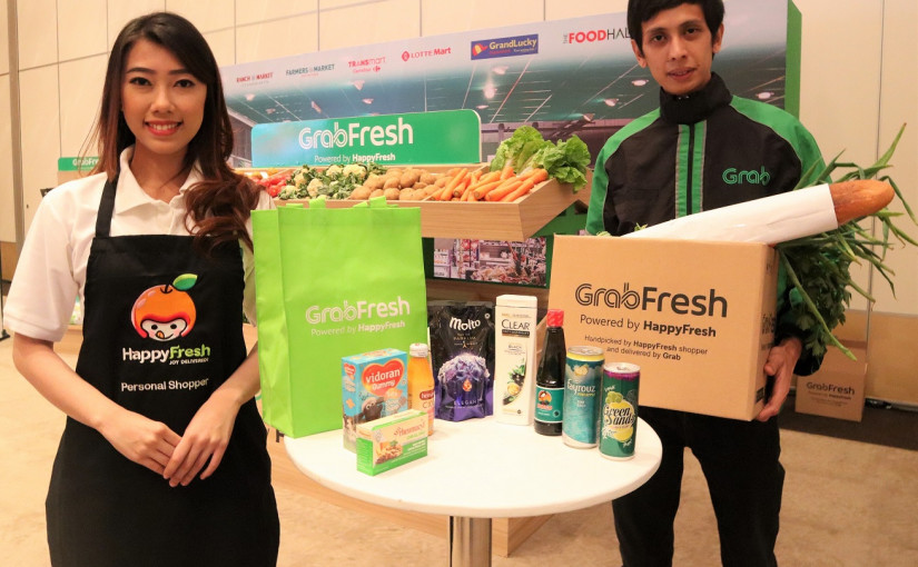 Grab meresmikan kehadiran layanan online grocery GrabFresh, hasil kolaborasinya dengan HappyFresh, siap bersaing dengan Go-Shop dan Go-Mart milik Go-Jek